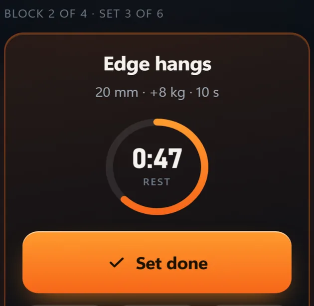 Set three of six during edge hangs on a 20 mm edge at plus 8 kg for 10 seconds, with 47 seconds of rest left on the timer.
